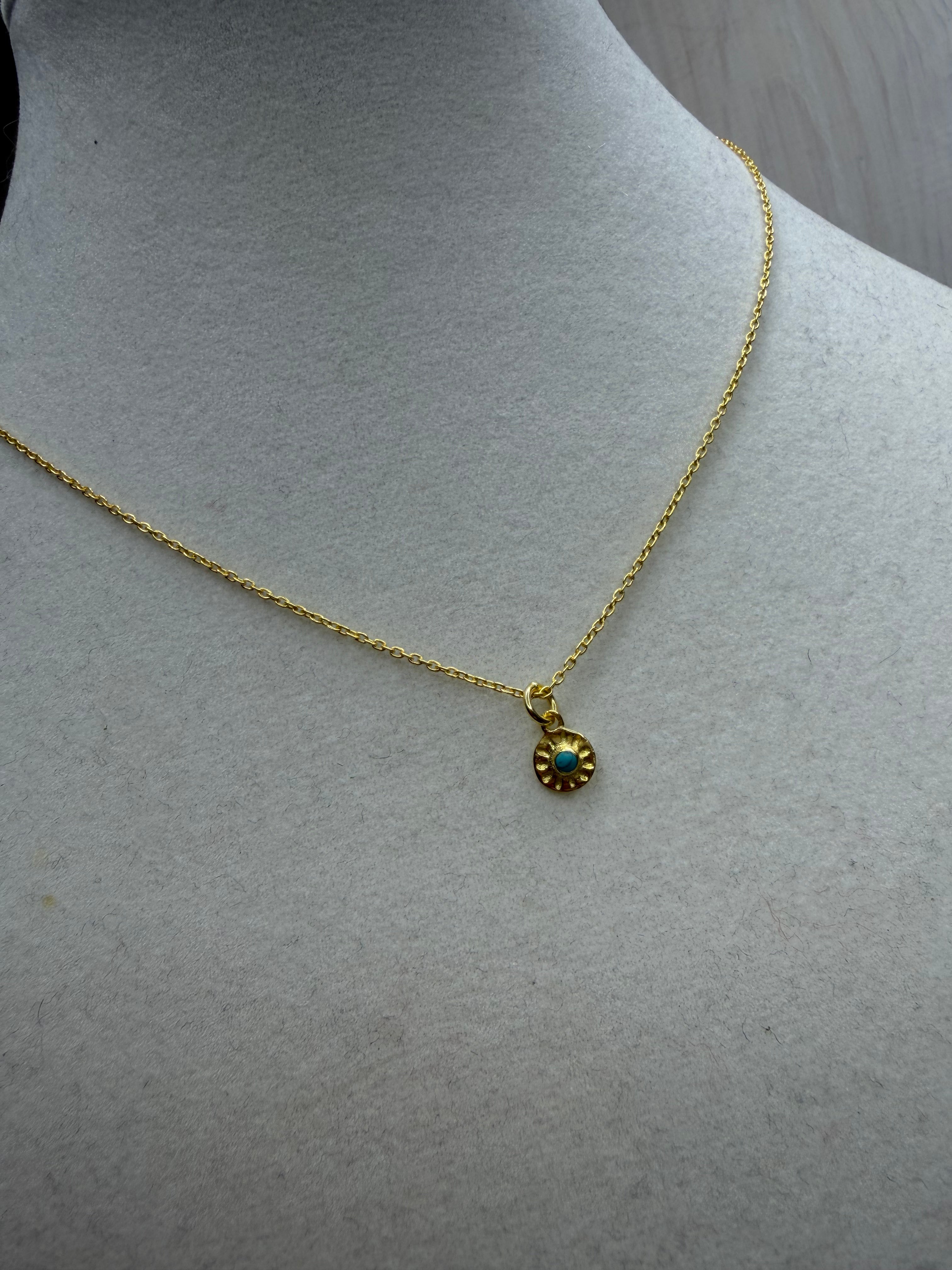 Embossed disc necklace