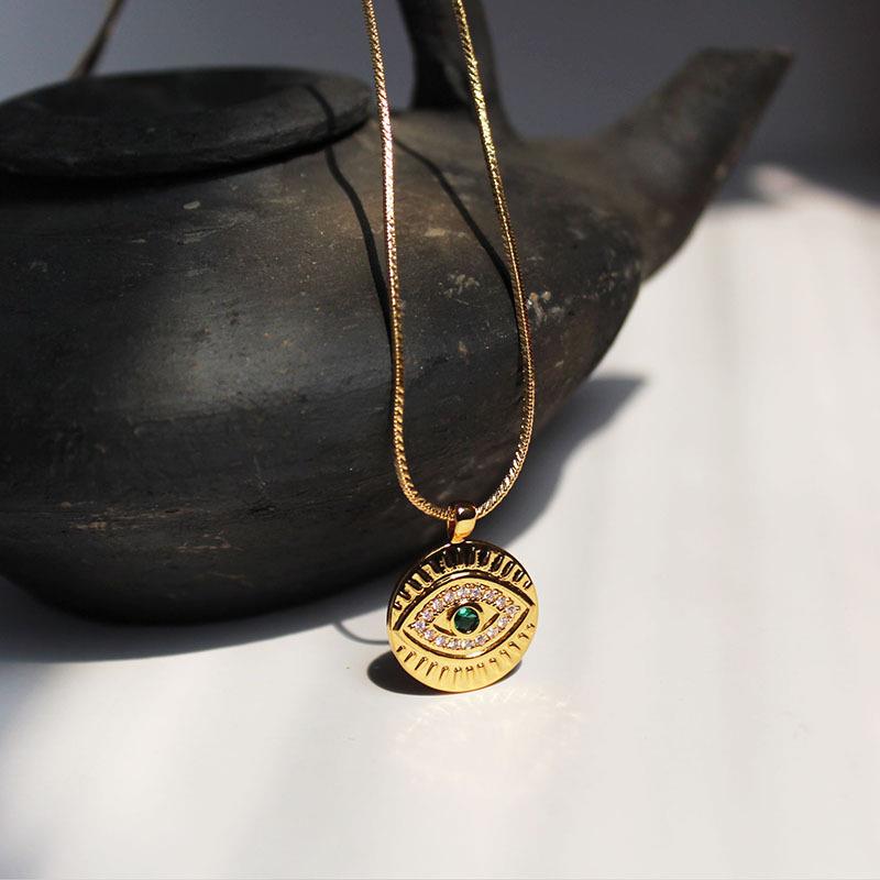 Evil eye disc pendant necklace in gold & green