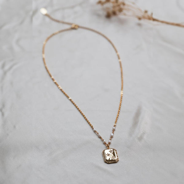 Star stamped CZ & pearl necklace in gold