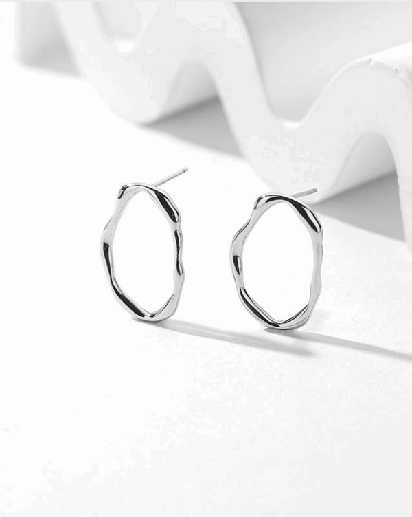 Misshapen oval earring in silver