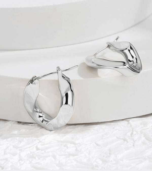 Misshapen oval hoop in silver